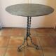 Round and antique metal side table