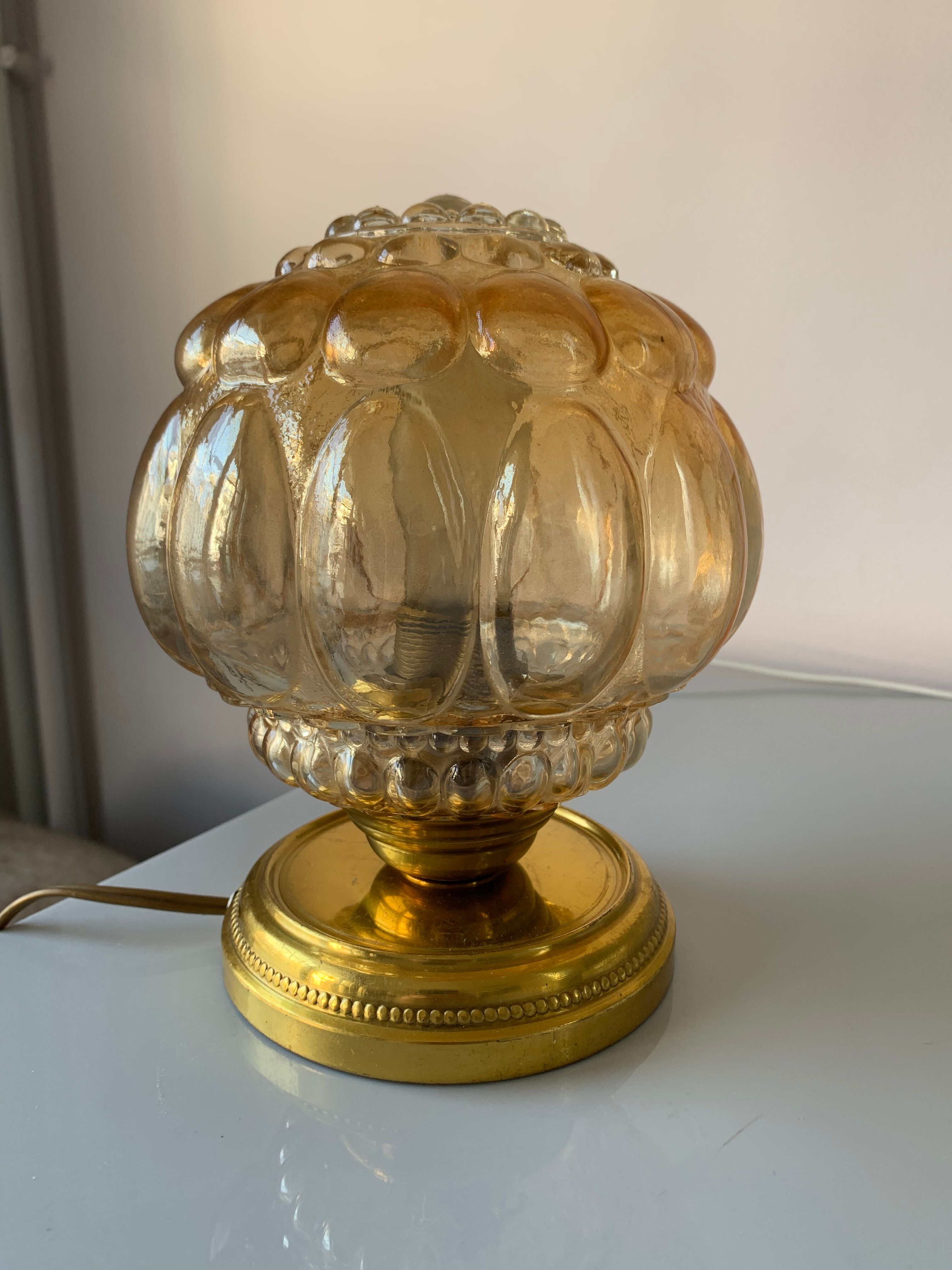 Old vintage table lamp made of amber molded glass