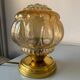 Old vintage table lamp made of amber molded glass
