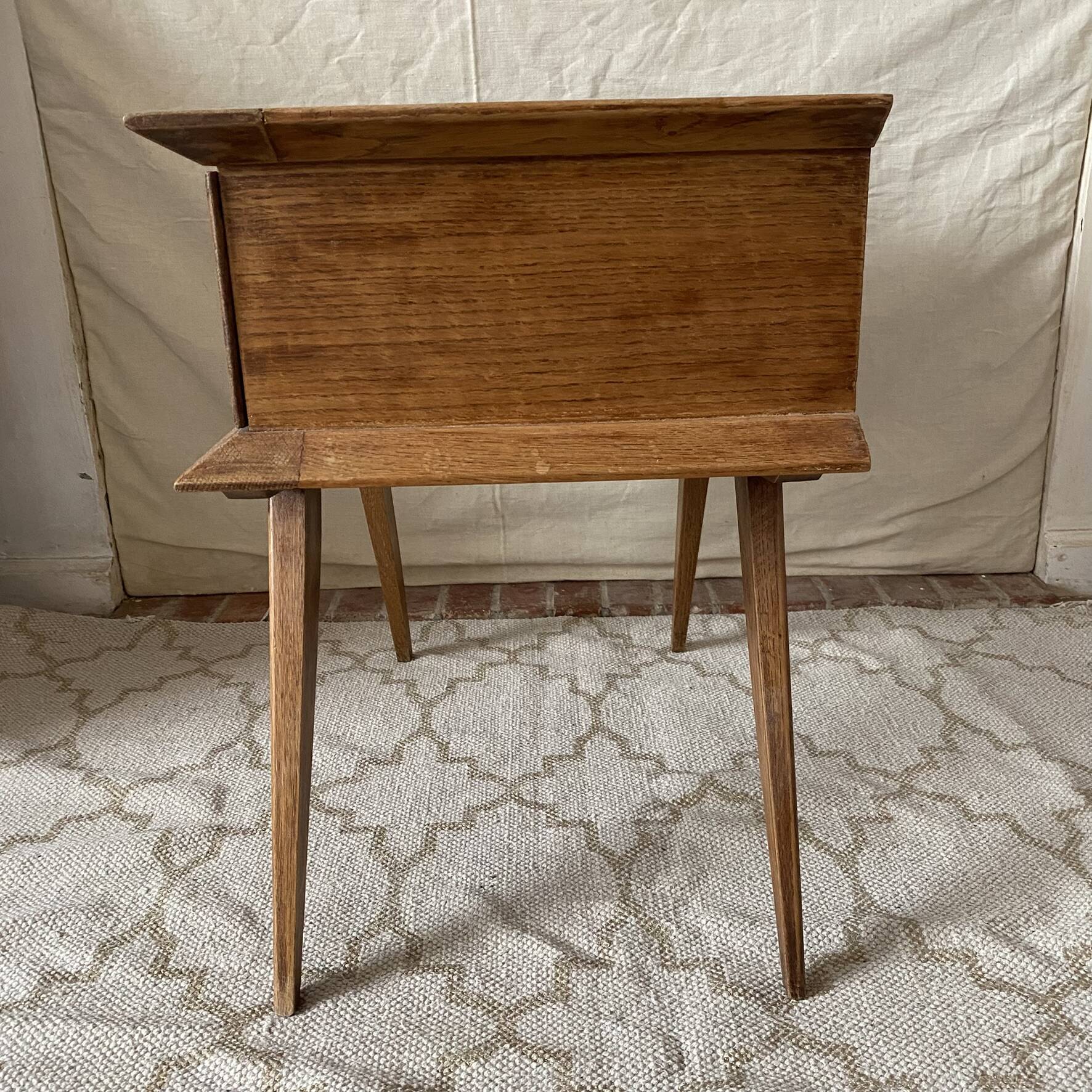 Scandinavian style bedside table with tapered legs from the 1960s.