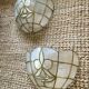 Pair of vintage wall lights in mother-of-pearl and gilded brass.