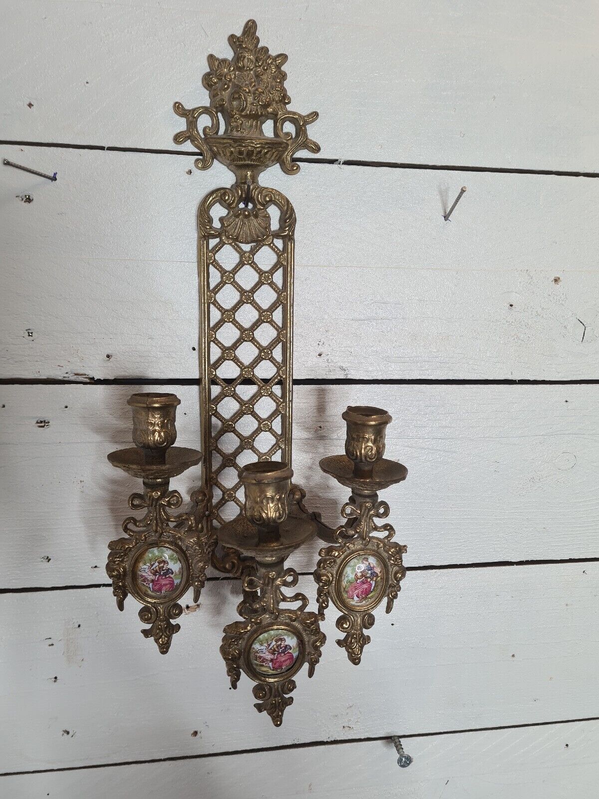 Bronze wall candle holder