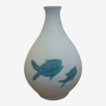 White ceramic with dolphin motif