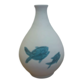 White ceramic with dolphin motif