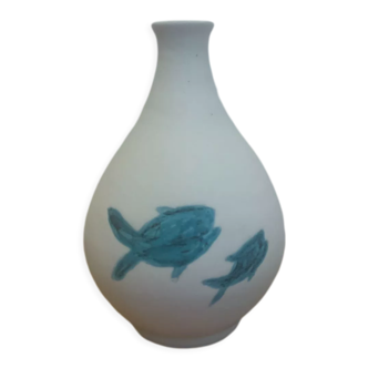 White ceramic with dolphin motif