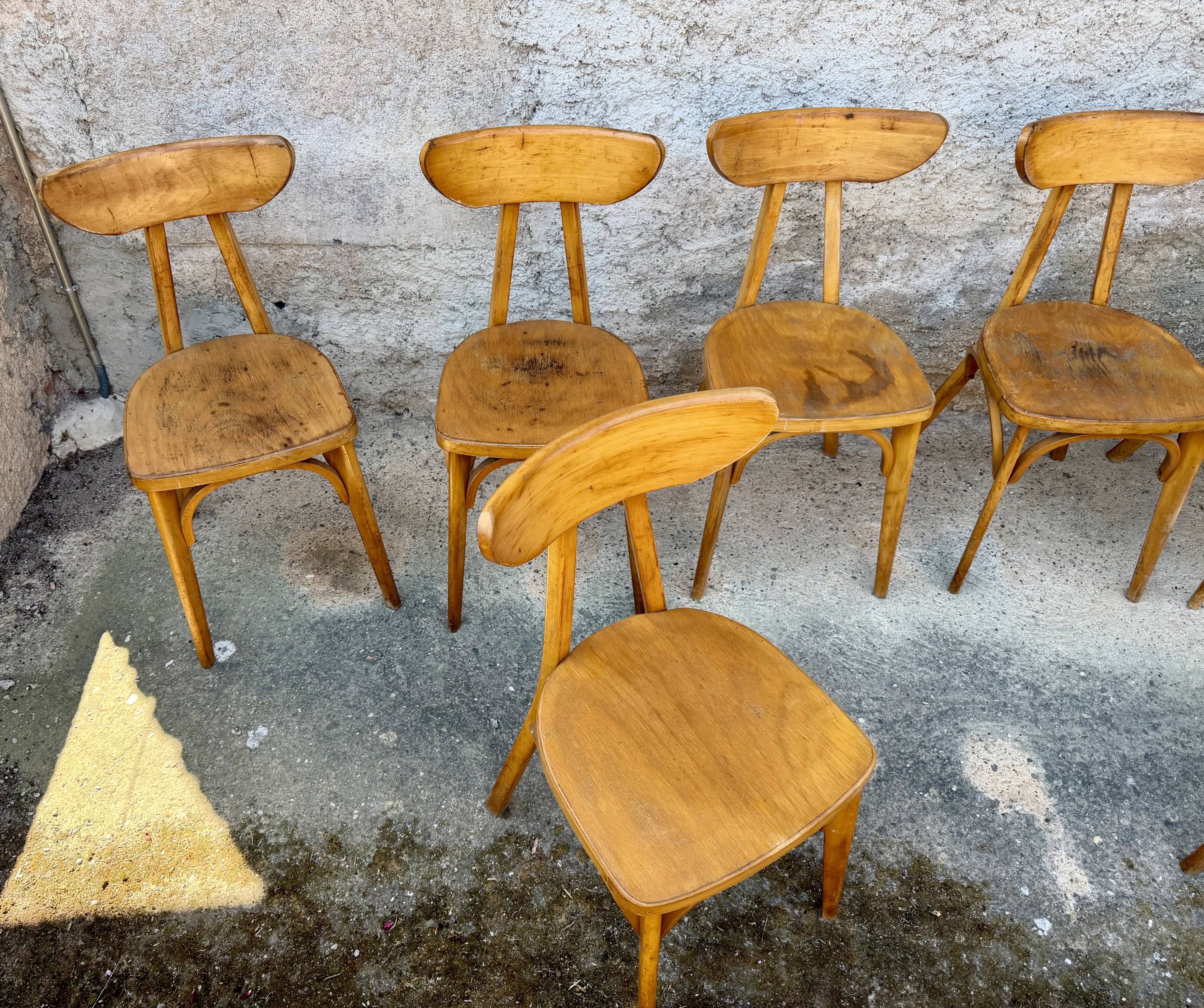 Set of 9 lutherma banana boomerang bistro chairs.