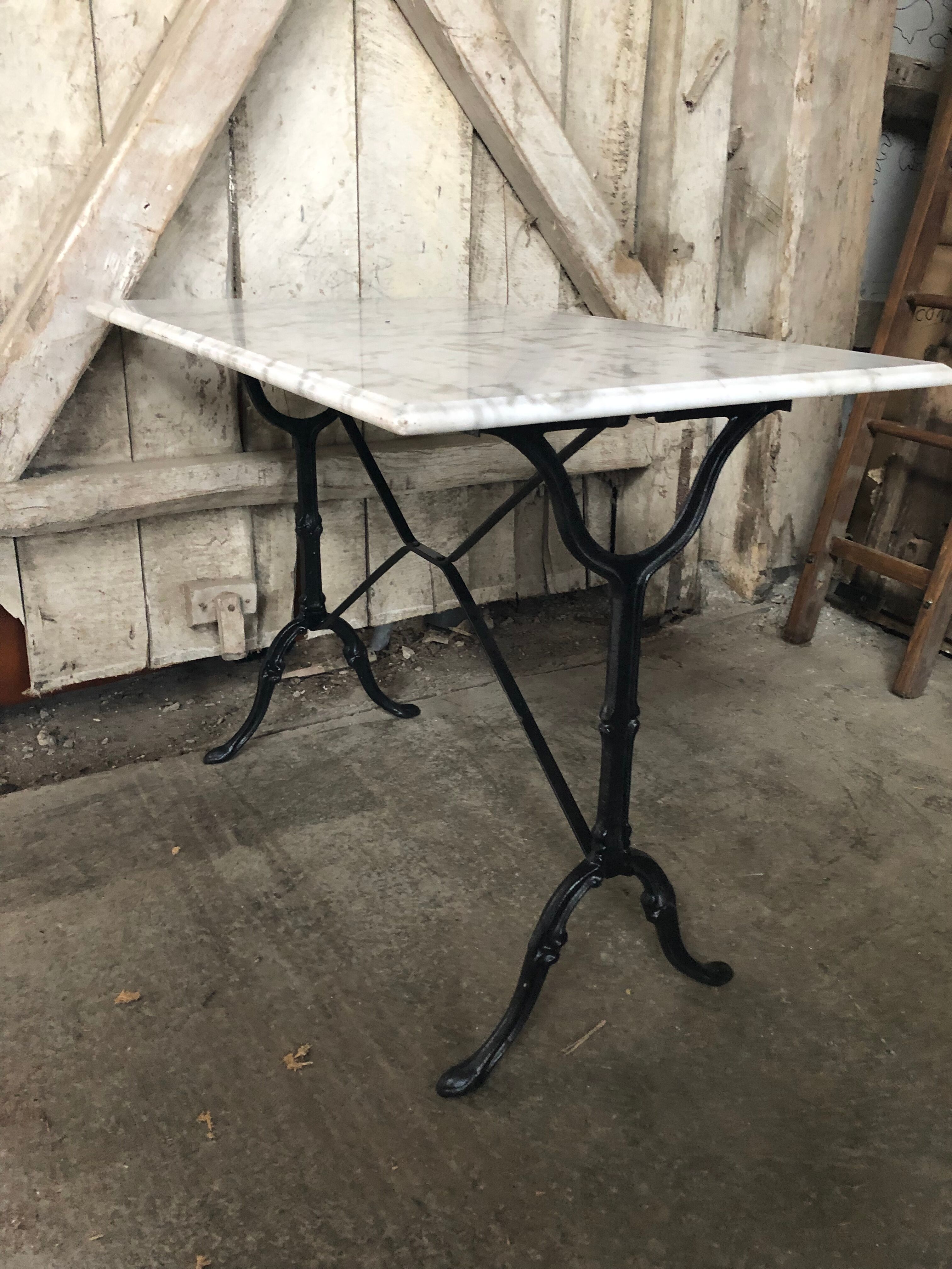 Old bistro table pied fer wrought black + white marble top vintage