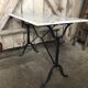 Old bistro table pied fer wrought black + white marble top vintage