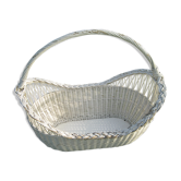 White wicker cradle basket