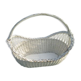 White wicker cradle basket