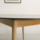 Round table, black lacquered top, solid oak base