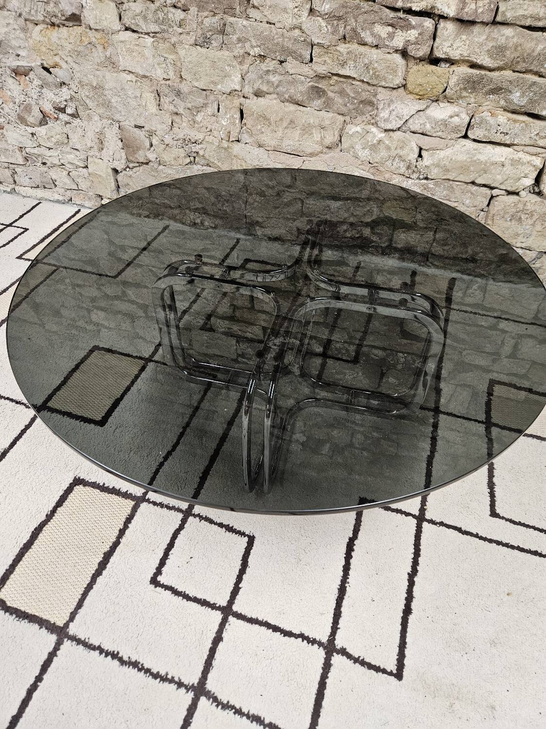 Round chrome coffee table with smoked glass