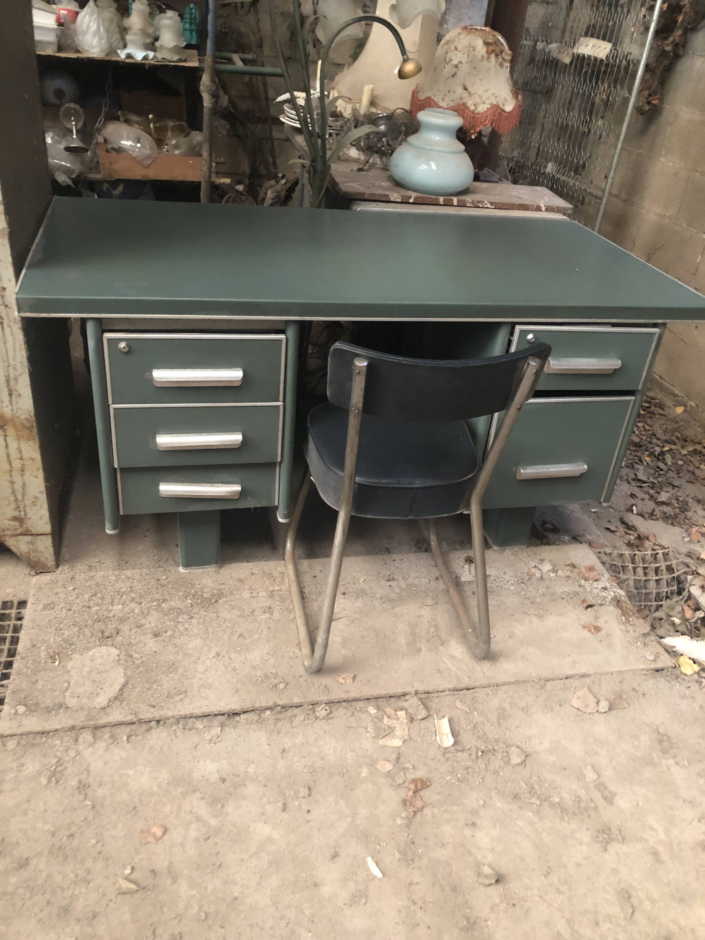 Old metal desk with chair