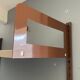 Modular metal wall shelf in brown and beige vintage 70s design.