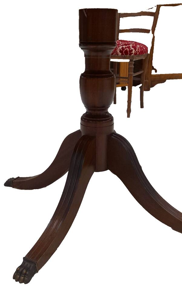 English style round table with green and gold leather top, quadripod with brass claws