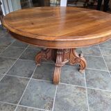 Extendable walnut table in the Napoleon III style.