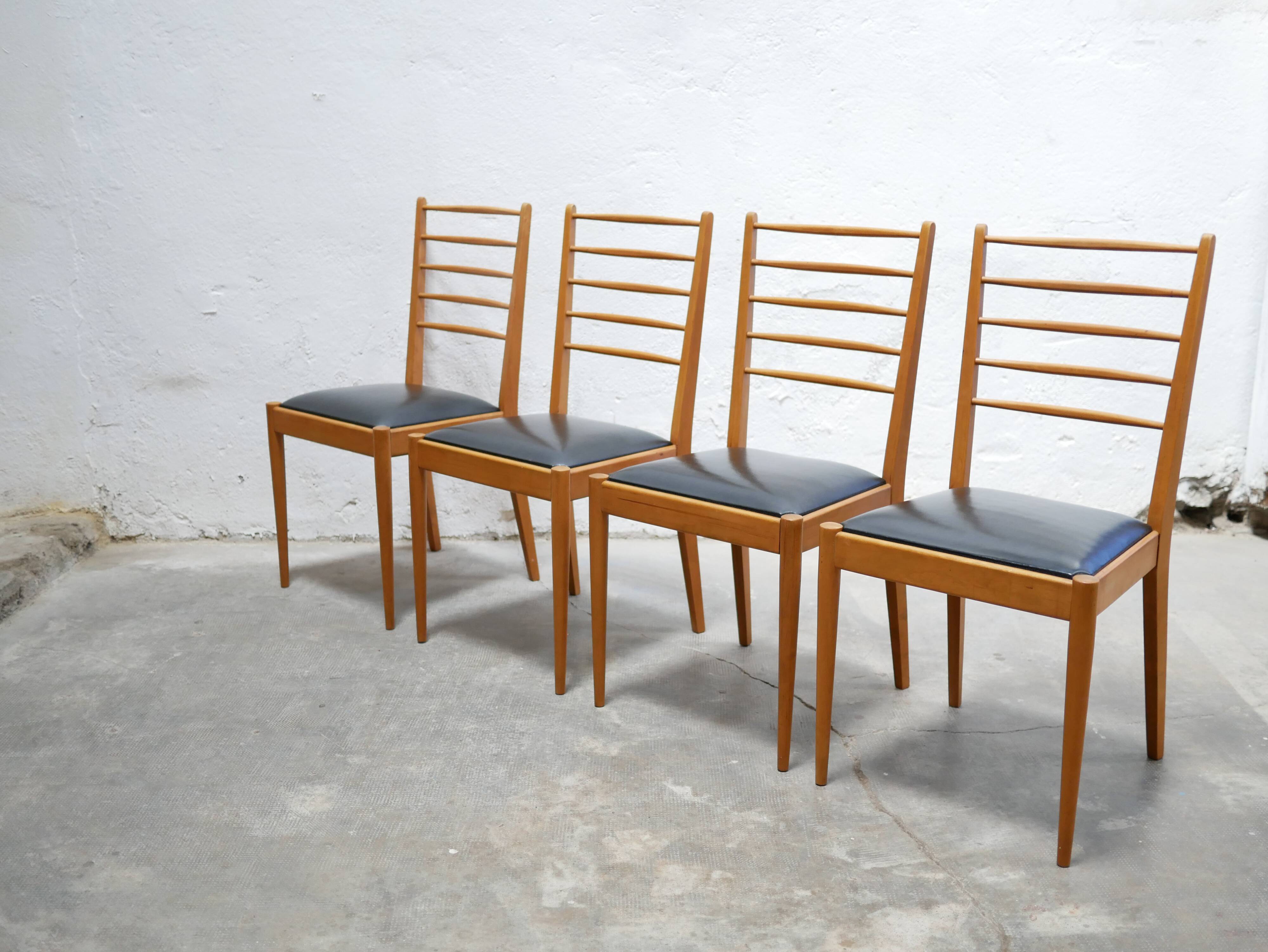 Series of 4 vintage chairs in wood and skaï