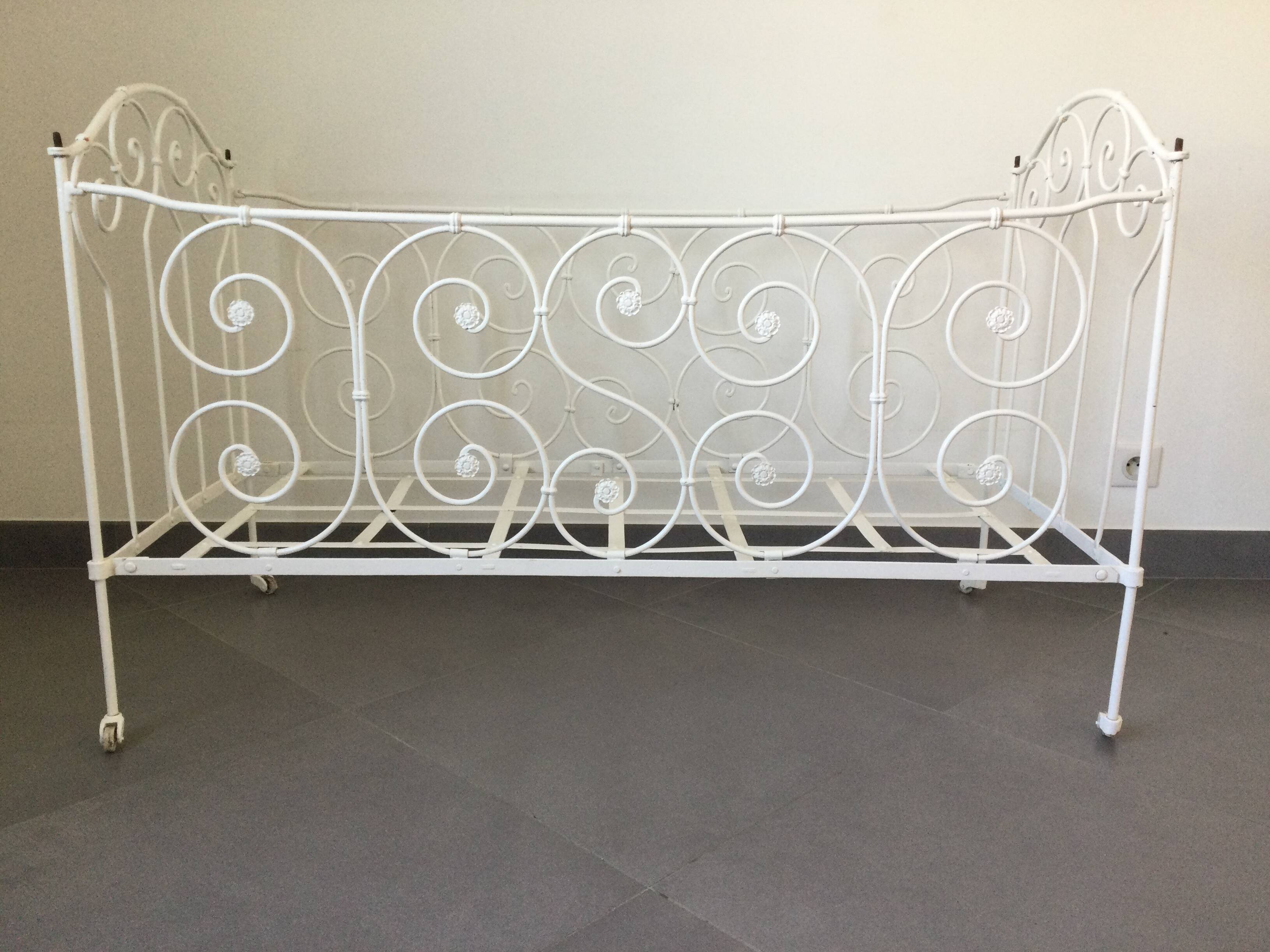White wrought iron folding bed