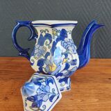 Cobalt blue teapot with flower pattern. Hexagonal teapot
