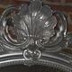 Louis xv style mirror with silver patinated shell