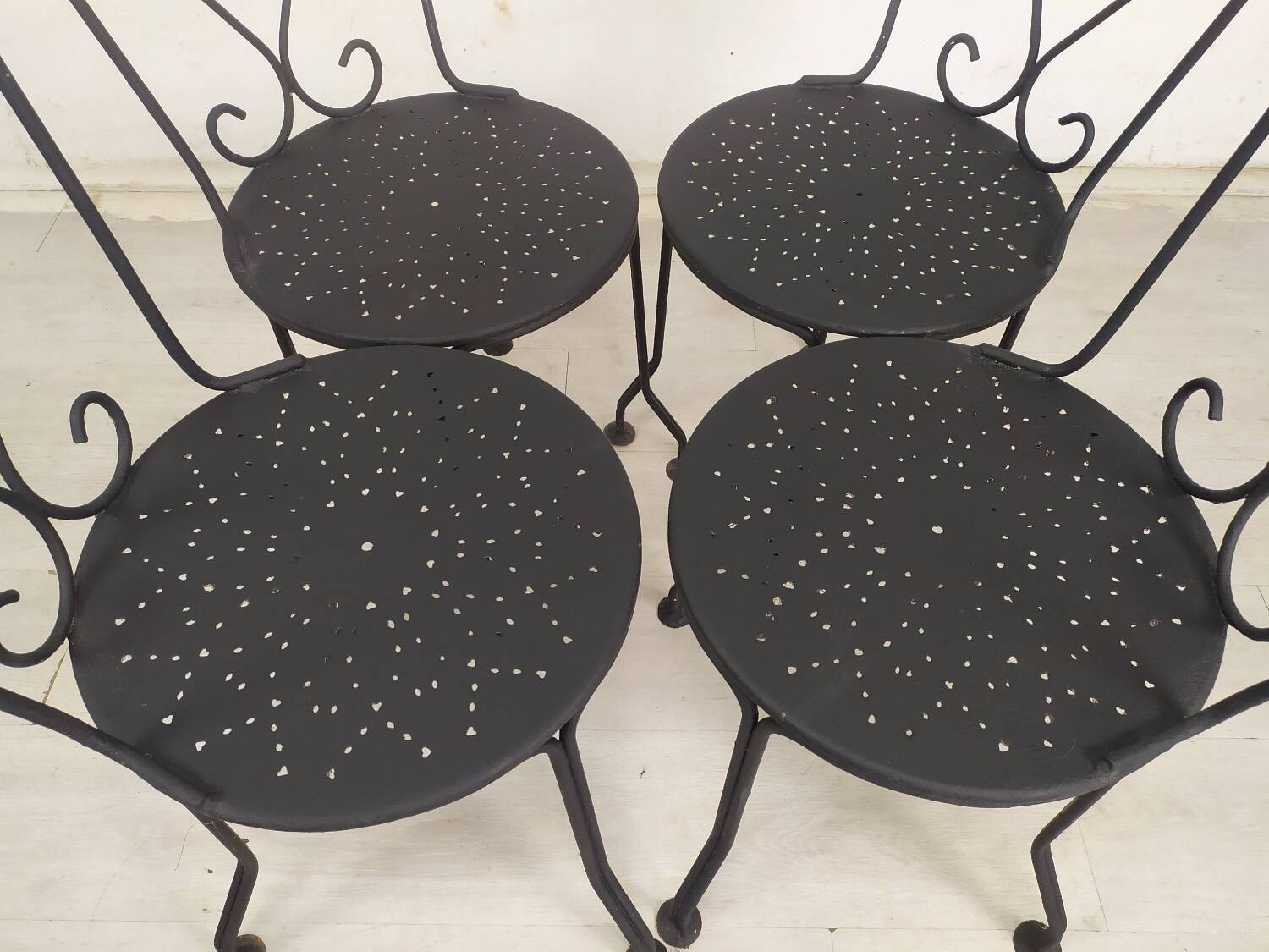 4 black garden chairs