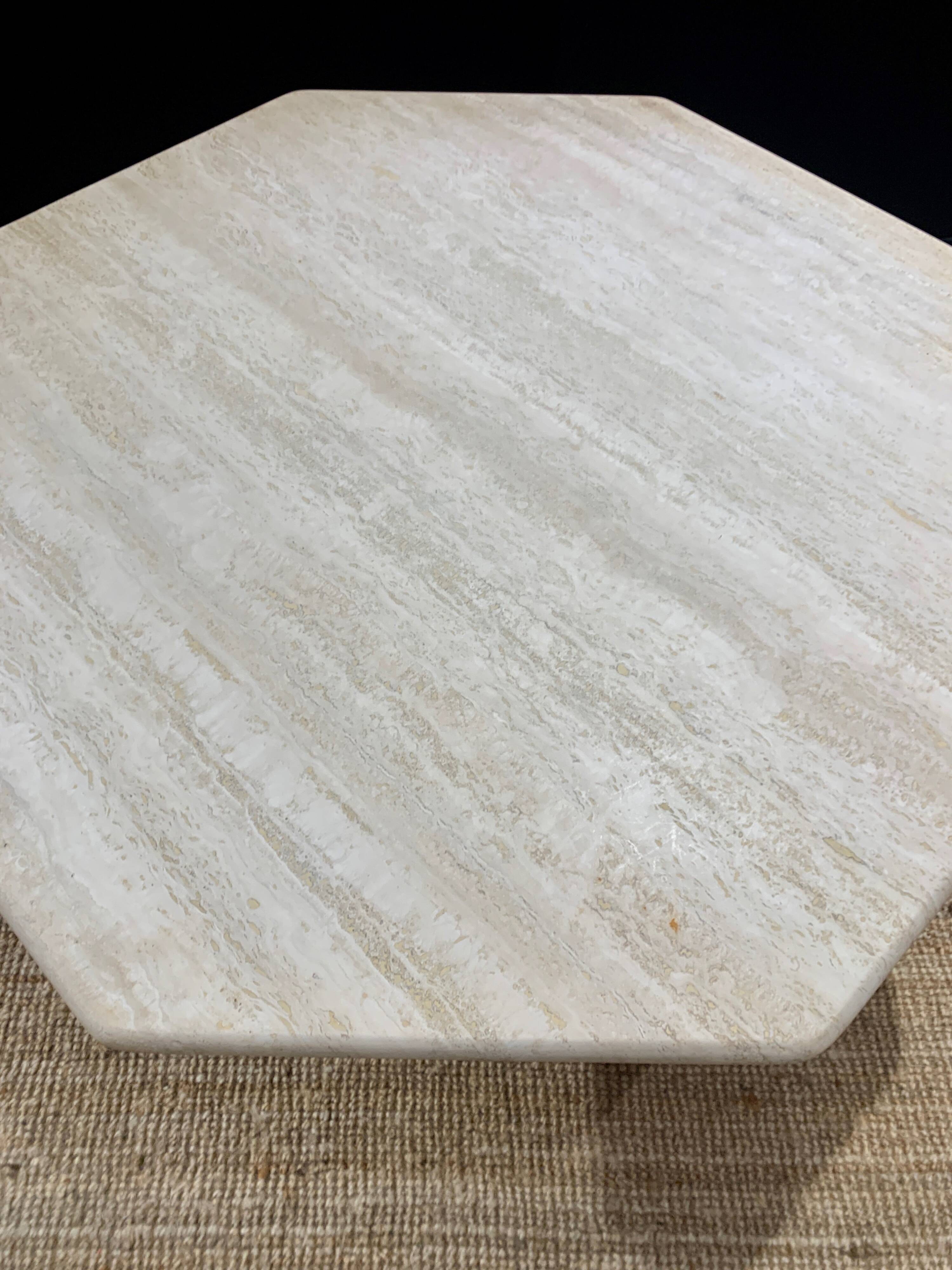 Octagonal table in light travertine
