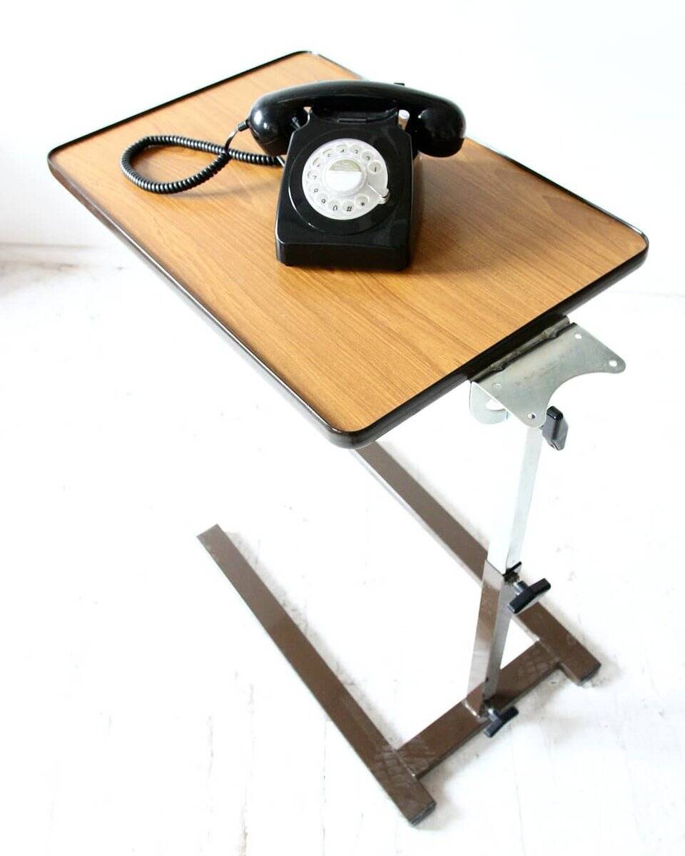 Extendable vintage desk from the 1960s, brown wood and metal structure, practical mid-century design.