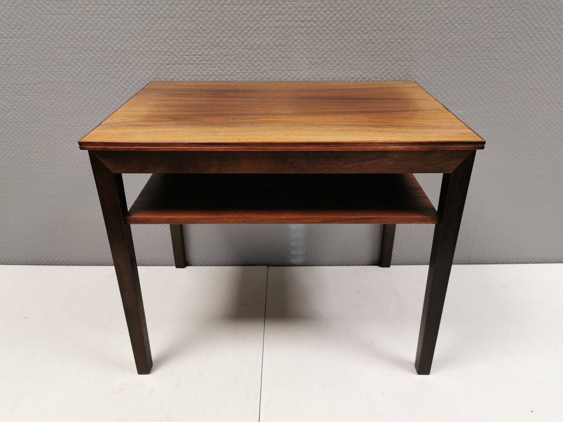 Nice side table in rosewood, probably Danish and from the 60s.