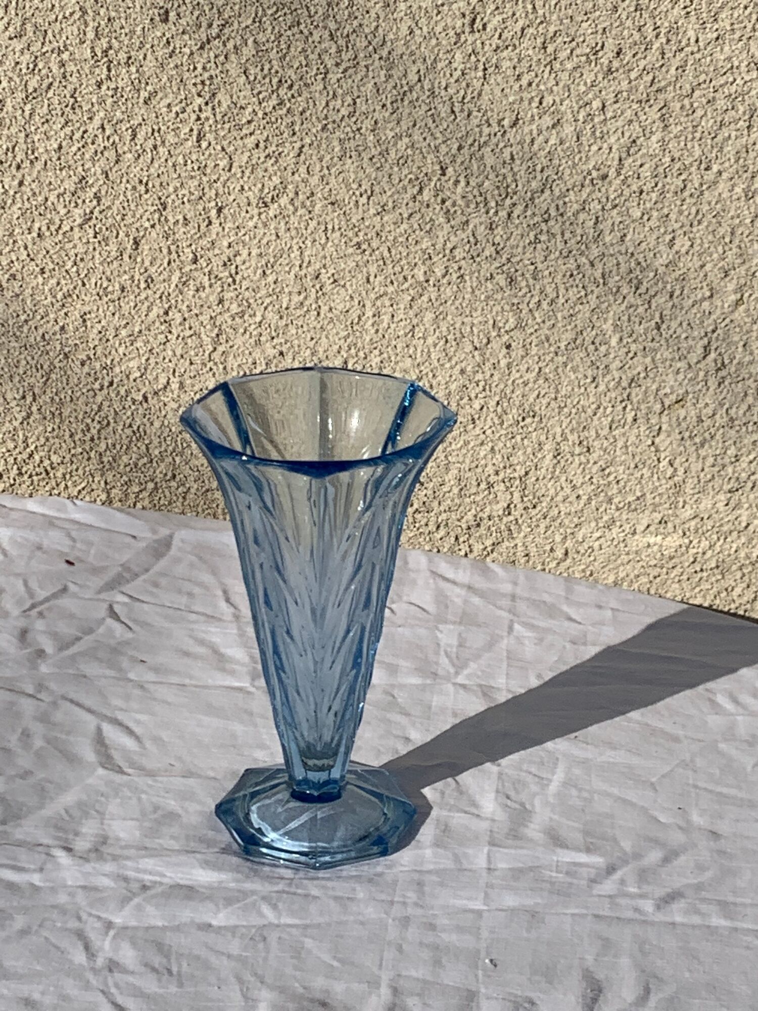Blue molded glass vase in art deco relief