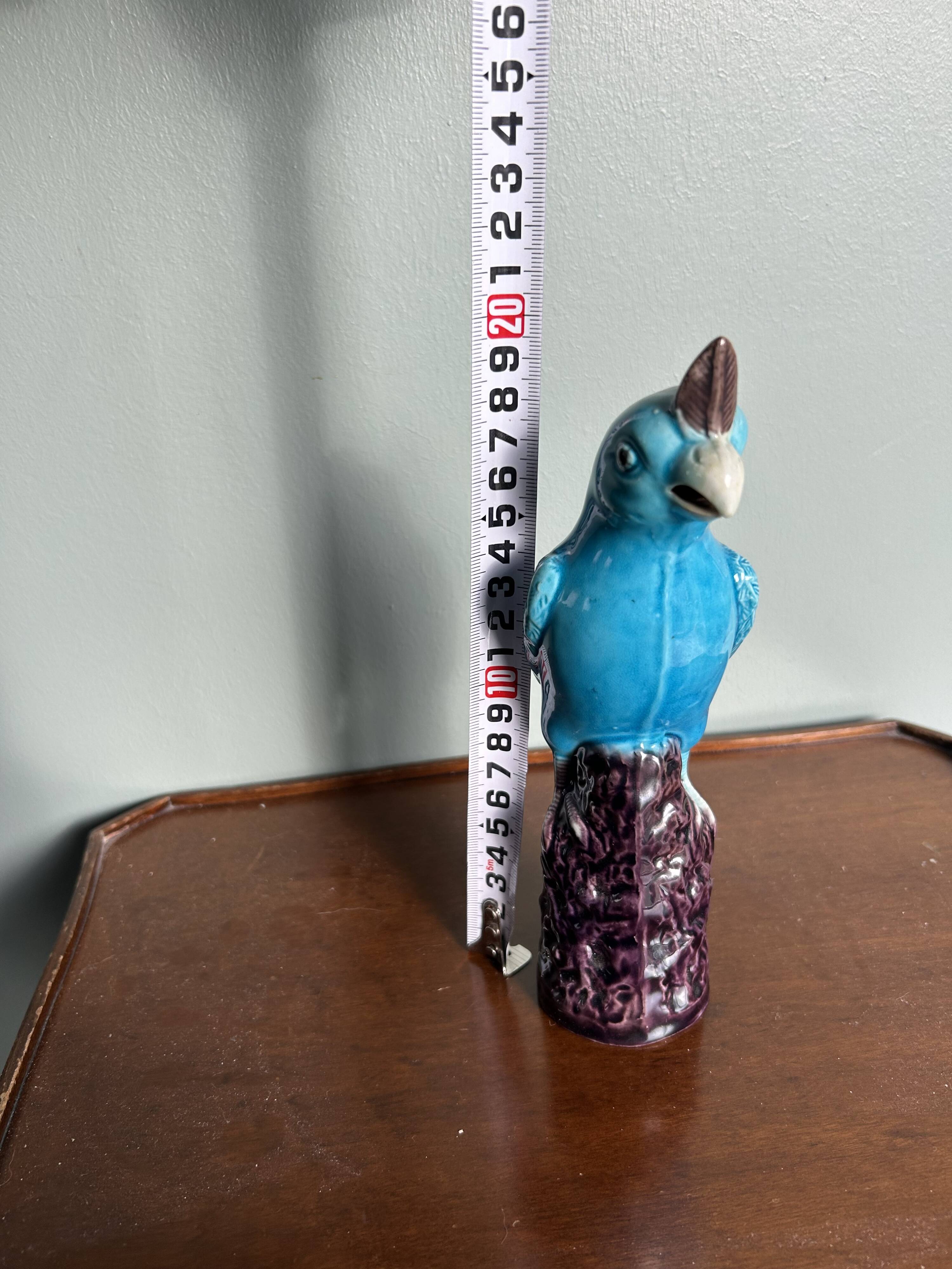 Porcelain parrot statuette