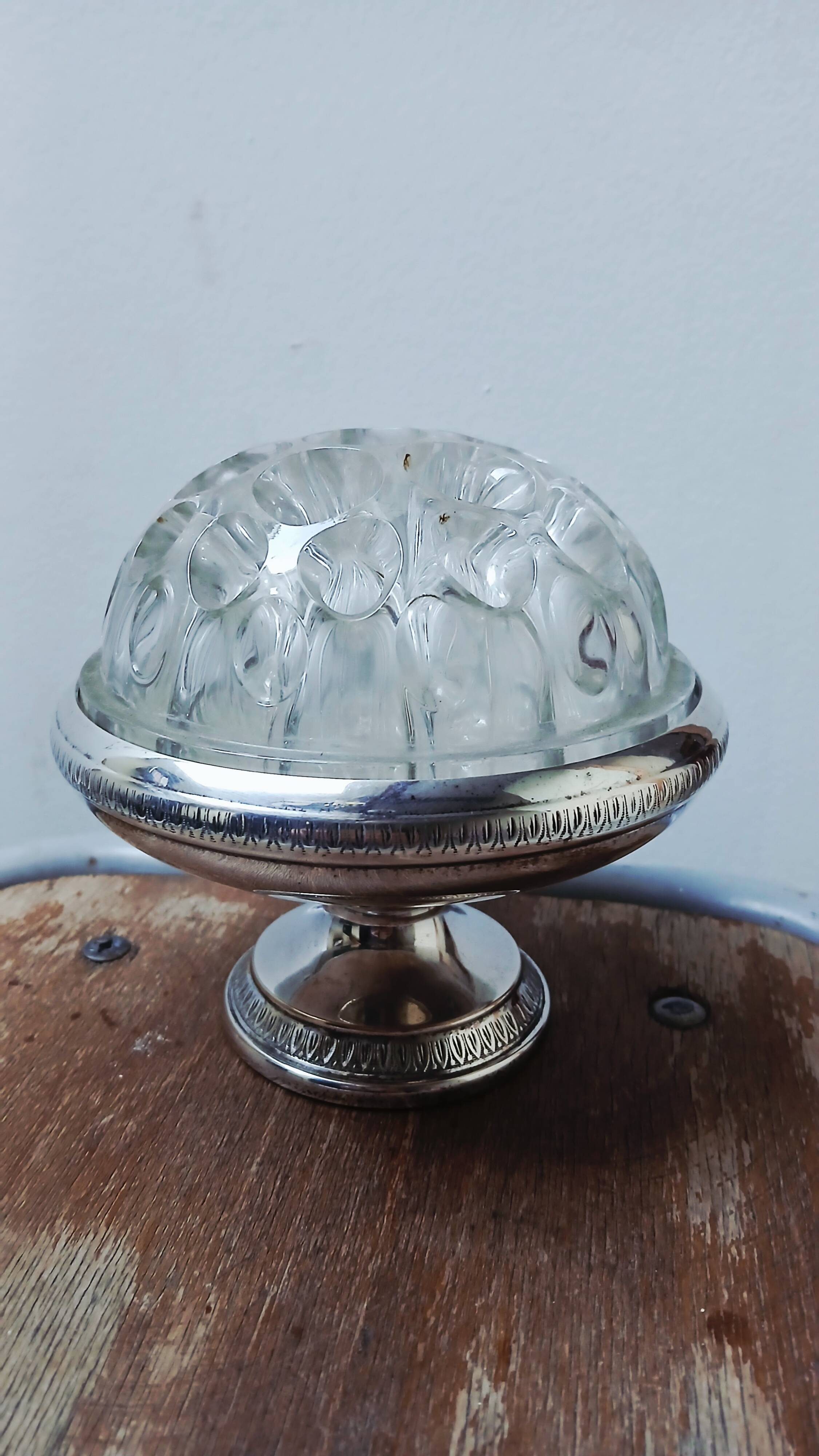 Glass flower arrangement from REIMS on a silver-plated metal stand.