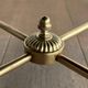 Round coffee table in brass with a black lacquered glass top from Maison Jansen.