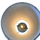 Vintage ceramic floor lamp with illuminated base.