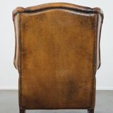 Sheep leather wingback chair with patina