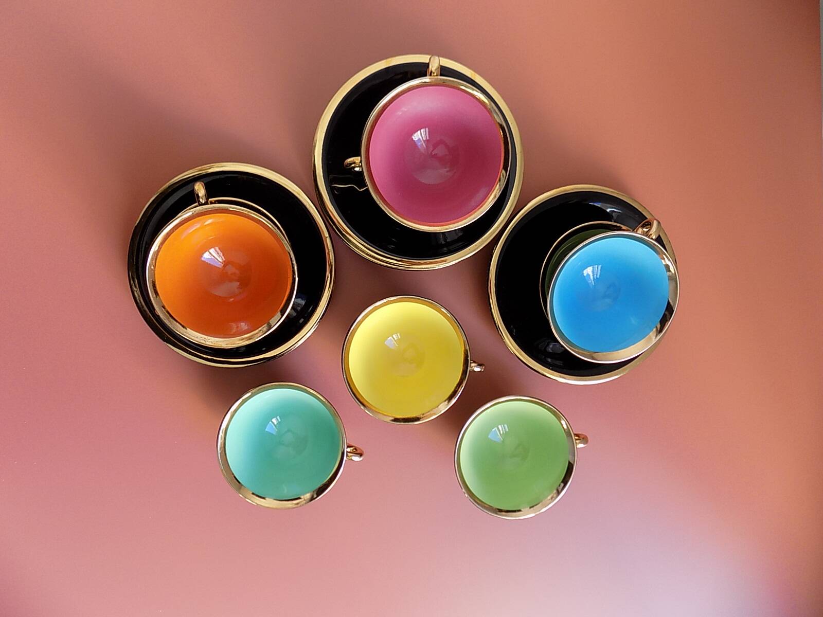 set of 9 black and gold Salins cups and saucers