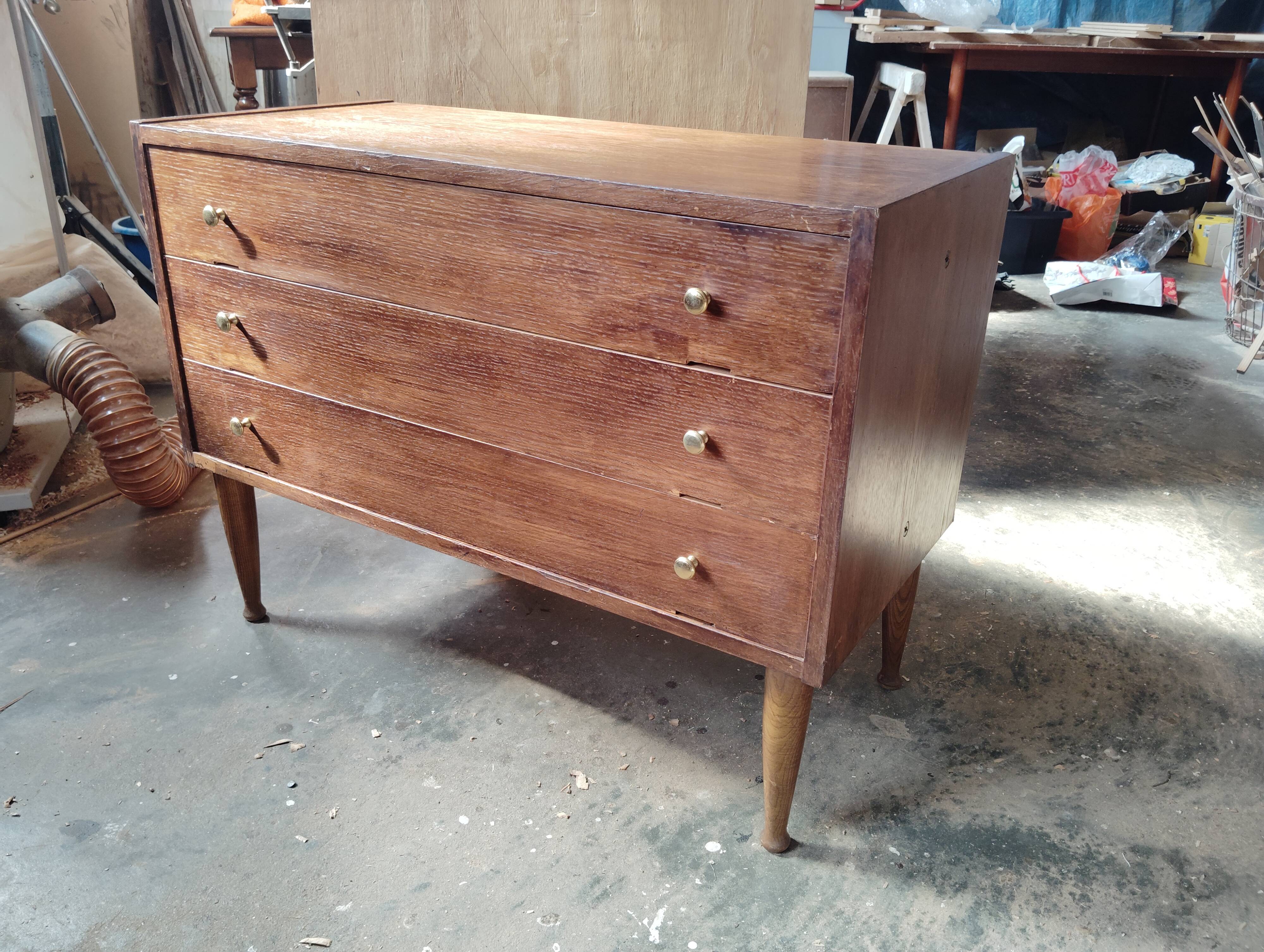 Vintage commode with tapered legs.