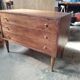 Vintage commode with tapered legs.