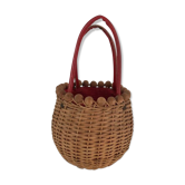 Wicker basket with a wooden bead border