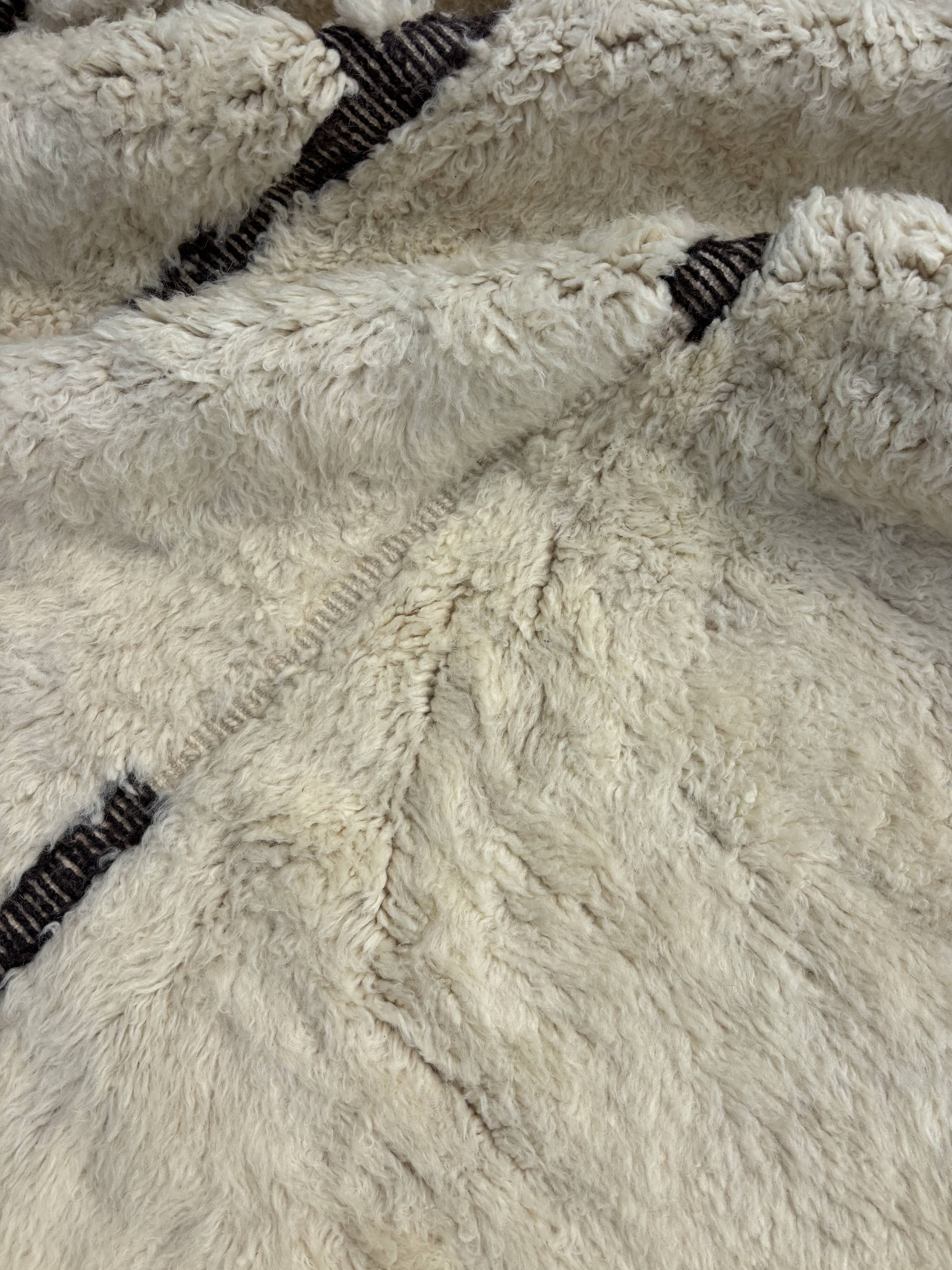 Large Berber M'rirt rug in cream and black wool, Moroccan rug.