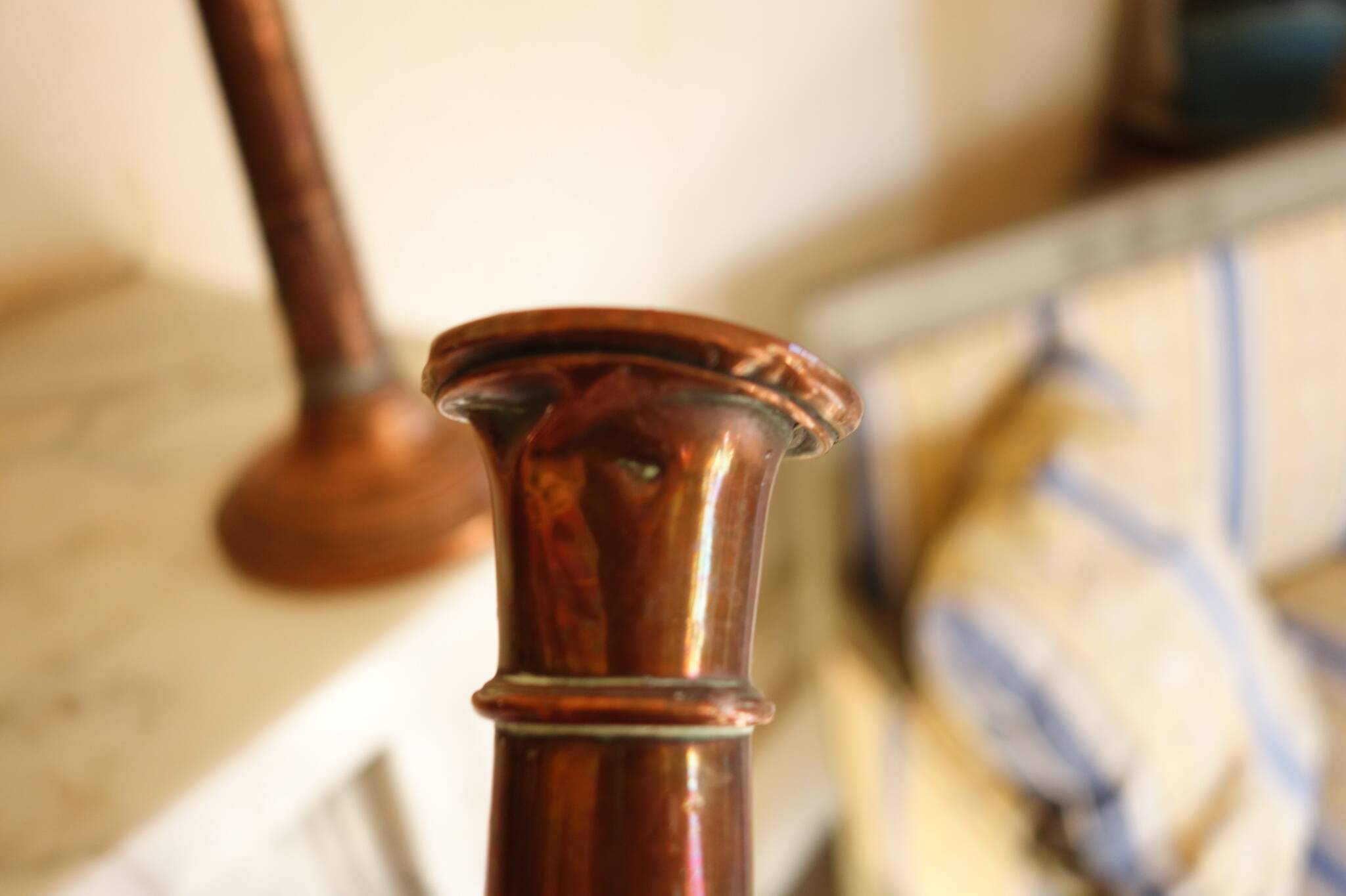 Pair of antique copper candlesticks
