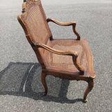 Fauteuil canné sculpté style Régence