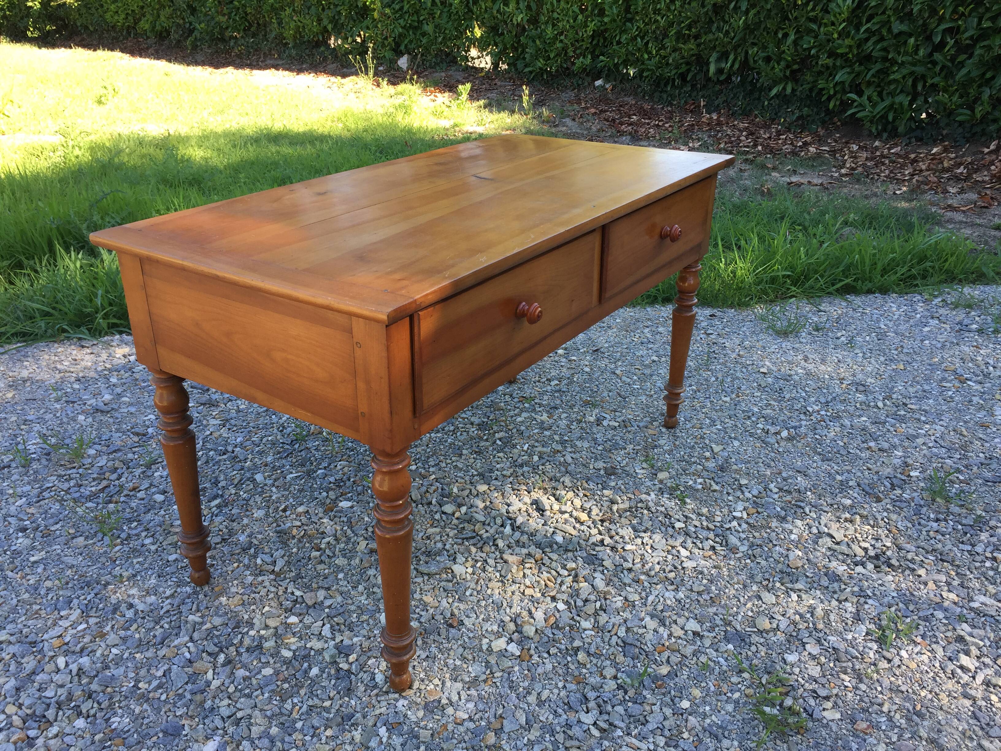 Old farmhouse table louis Philippe style in solid cherry with turned feet.