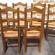 Set of 6 oak dining chairs with high backs and straw seats