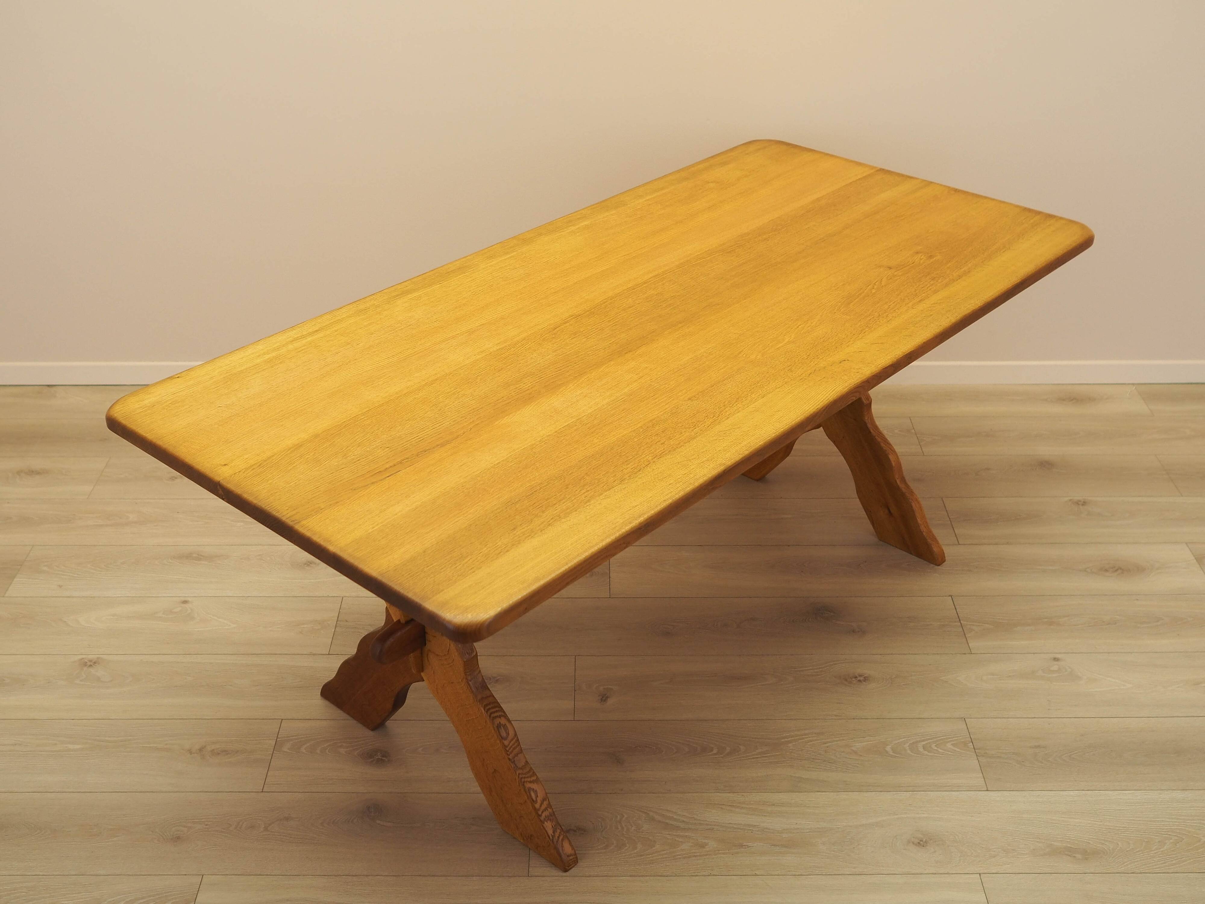 Solid oak dining table by Henning Kjærnulf, Denmark, 1960s