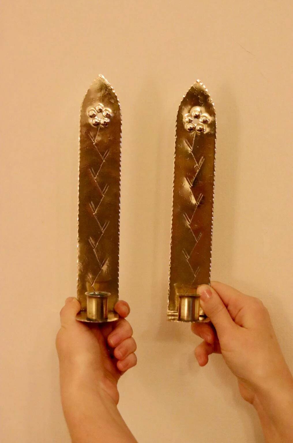 A pair of Swedish brass wall sconces from the mid-century.