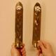 A pair of Swedish brass wall sconces from the mid-century.