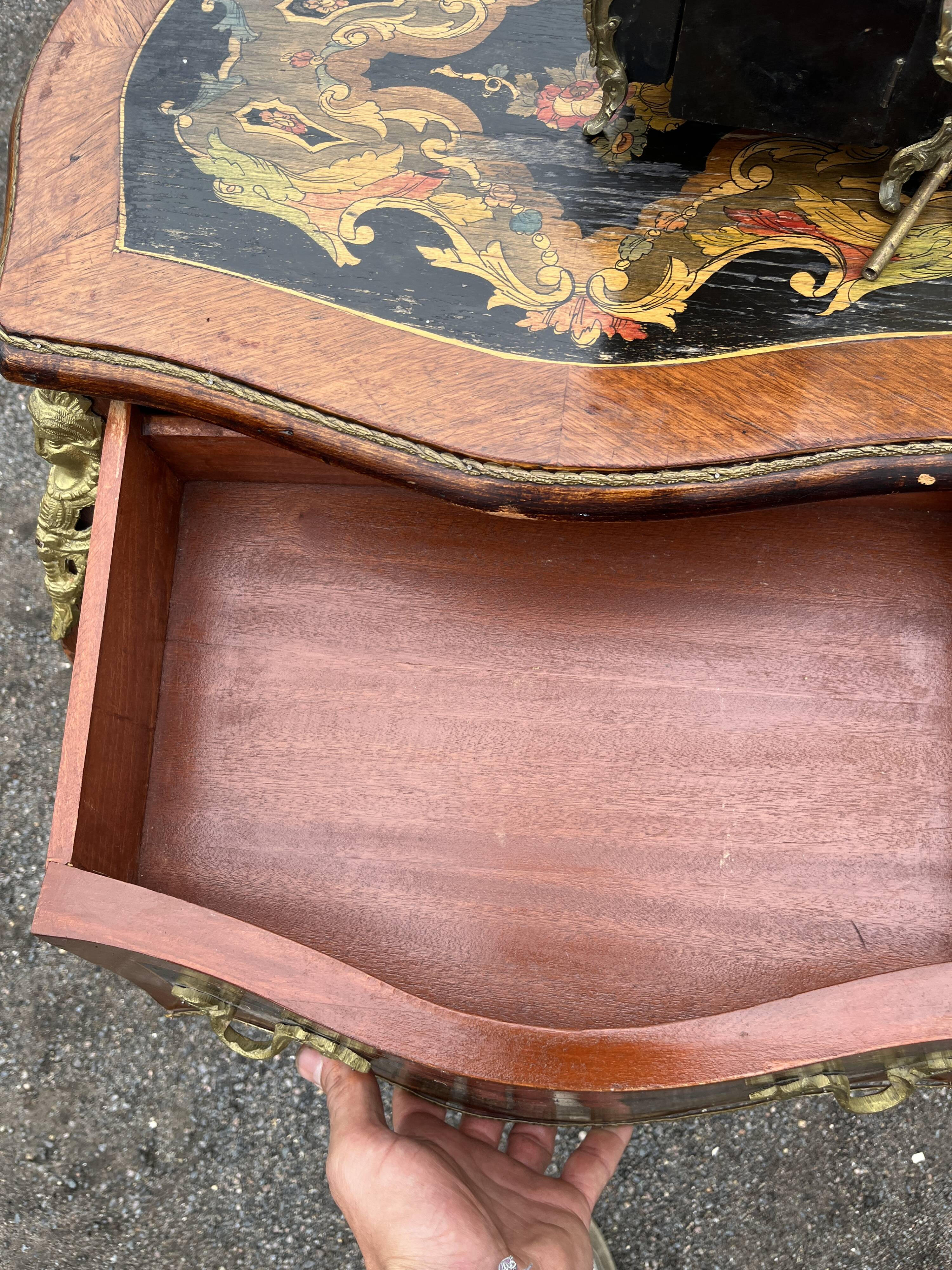 Louis XV style side table with marquetry and gilded bronze.