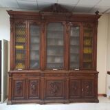 Glass-fronted walnut bookcase