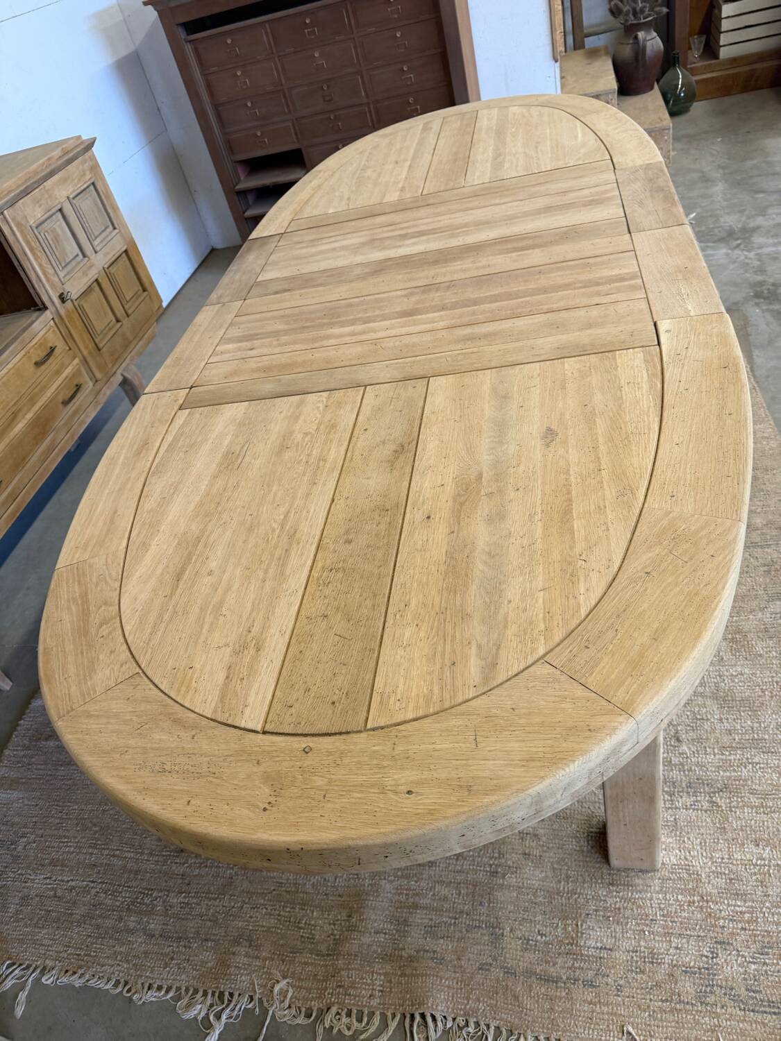 Oval farmhouse table in solid oak with extensions.