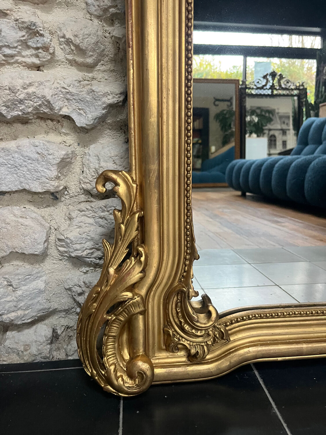Antique mirror 169/105cm with pediments and pearl detailing in gold leaf.